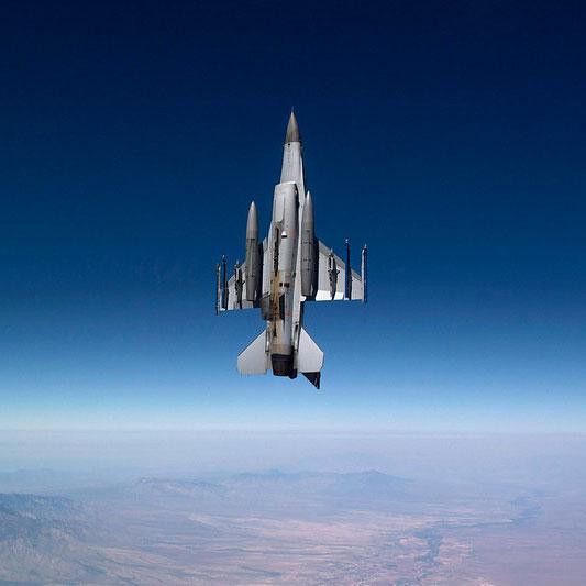 F-16 Jet headed flying up through the skies